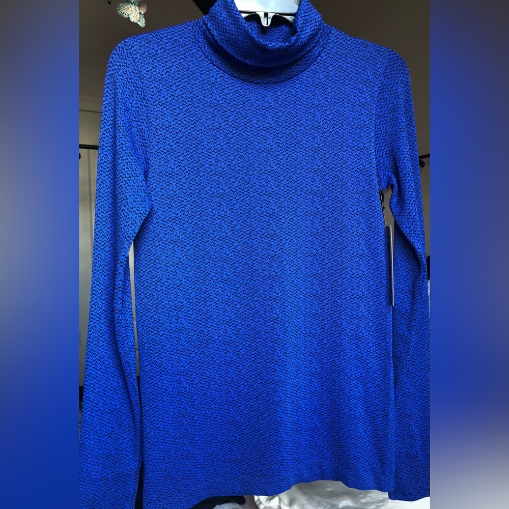 Athleta Turtleneck: “Flurry Peak Turtleneck” includes thumbholes; chafe free